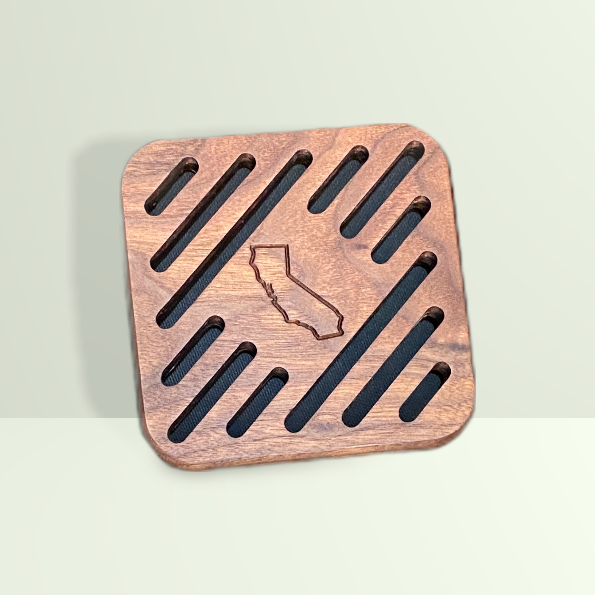 Wood trivet for holding hot pans; made from Walnut, designed by John Wayne Hill of DeathGhost Studios